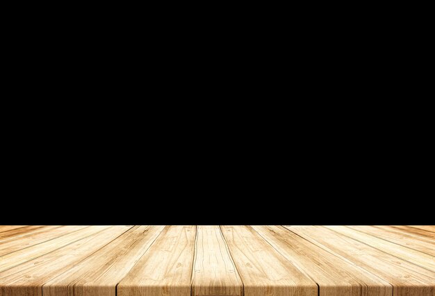 Foto tavolo di legno vuoto su sfondo nero