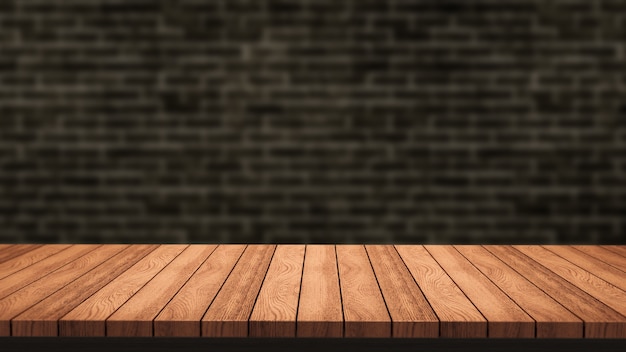 Empty wooden table and black brick wall