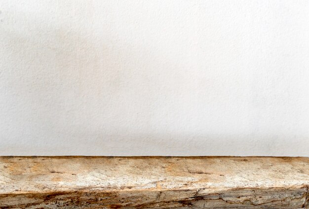 Empty wooden table on cement background, for display your product.