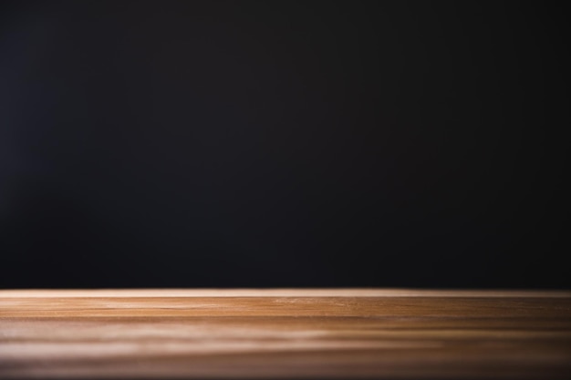 Empty wooden table dark background