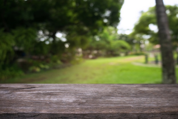 Empty wooden table in front of abstract blurred background of coffee shop . can be used for display Mock up  of product