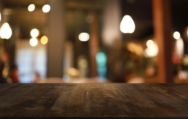 empty wooden table in front of abstract blurred background of coffee shop can be used for display or montage your productsmock up for display of product