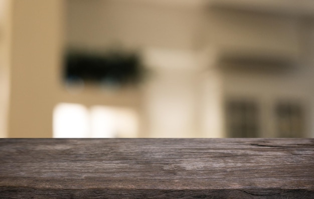 Empty wooden table in front of abstract blurred background of coffee shop can be used for display or montage your productsMock up for display of product