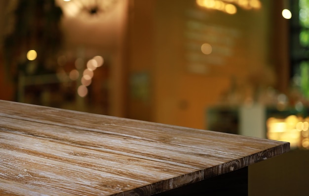 empty wooden table in front of abstract blurred background of coffee shop can be used for display or montage your productsmock up for display of product
