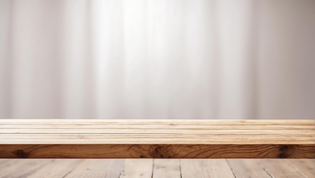 Empty wooden table in front with blurred white background