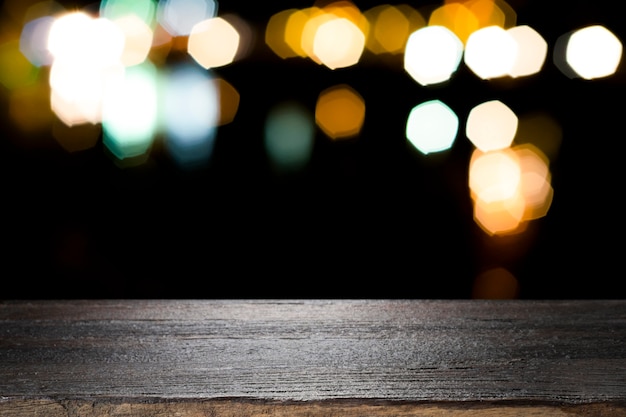 Empty wooden table platform and bokeh at night