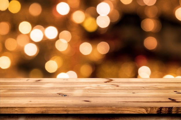 Empty wooden table for product placement or montage with focus to the table top blurred bokeh backgr