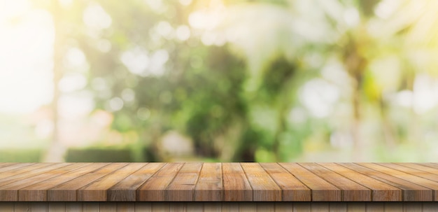 Empty wooden table top and Abstract blurred light bokeh and blur background of garden tree