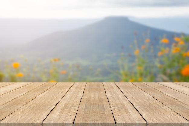 Empty wooden table top on blurred background at phu pa por mountian,space for montage products