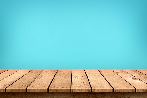 Empty wooden table top on pastel blue