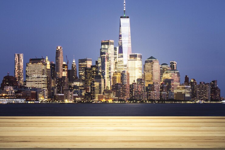 Photo empty wooden table top with beautiful new york skyscrapers at evening on background mock up