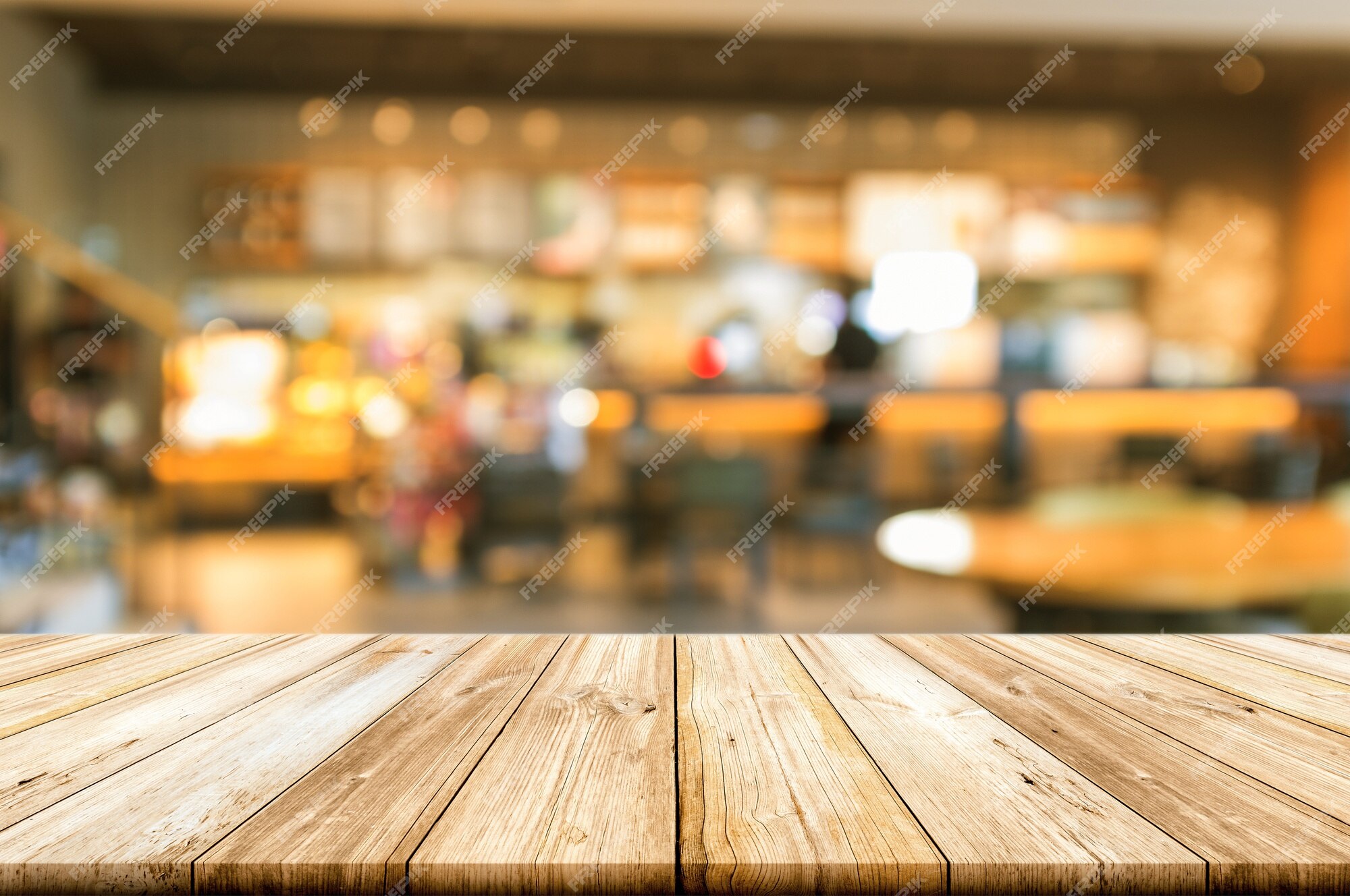 Premium Photo | Empty wooden table top with blurred coffee shop ...