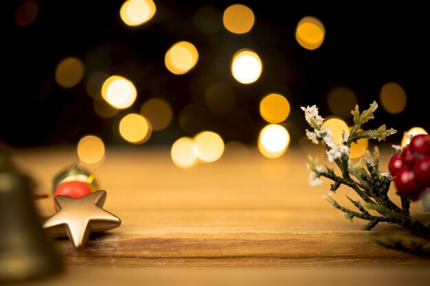 Empty wooden table with christmas decoration. Golden sparkles and bokeh on background. Design for your product concept photo