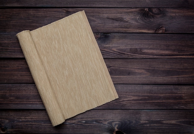 Empty wooden table with tablecloth