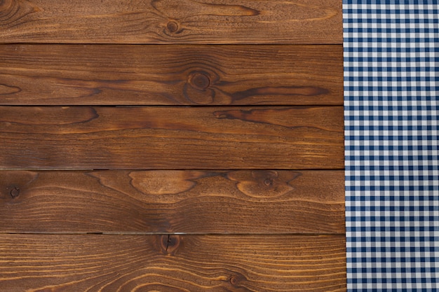 empty wooden table with tablecloth