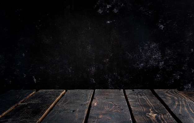 Photo empty wooden tabletop on dark wall background premium photo