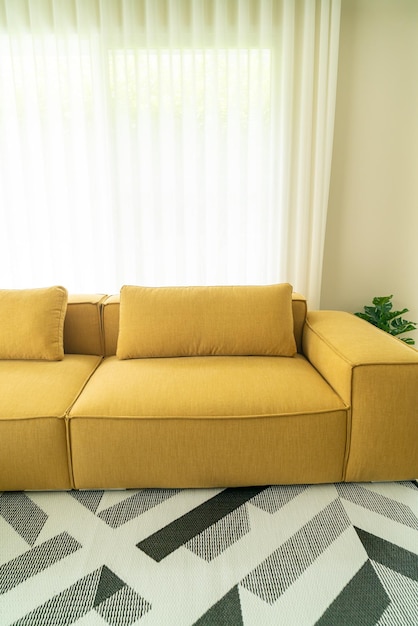 Empty yellow fabric sofa in living room