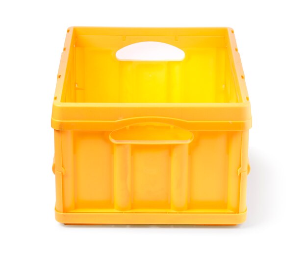 Empty yellow plastic crate isolated over white background with clipping path