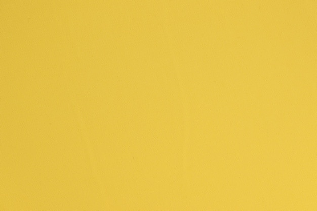 Empty yellow surface with template for design as background bright color wallpaper of fabric