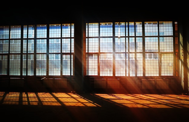 Emty industrial room with dramatic light rays background