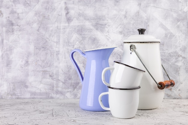 Enamel mugs and jug