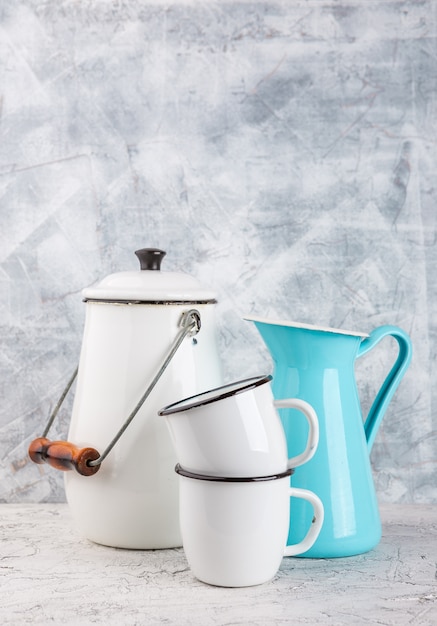 Enamel mugs and jug