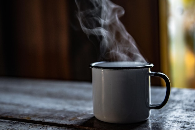 Photo enamelled cup of piping hot coffee being served in a farmhouse in the mountains