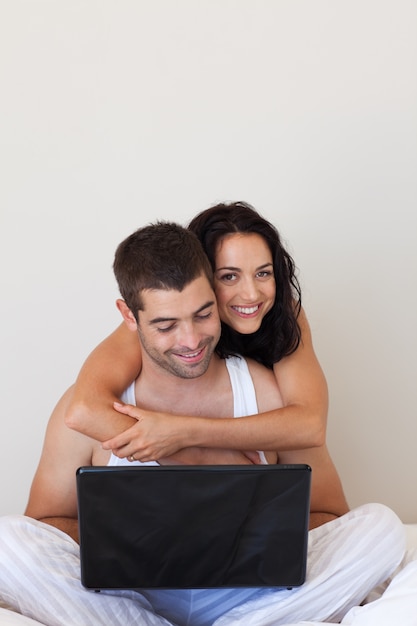 Enamoured couple with laptop