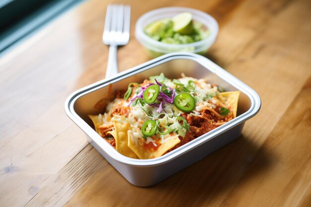 Enchiladas in a togo container for food delivery service