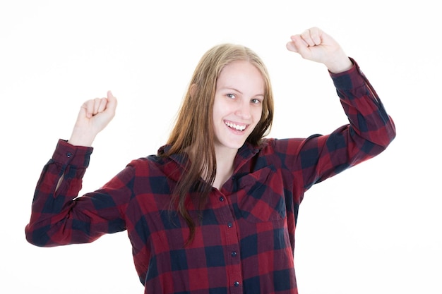 Encouraged and motivated cute blonde woman raising hands up fist pump from happiness smiling hear good news celebrating victory in winning huge bet over white background