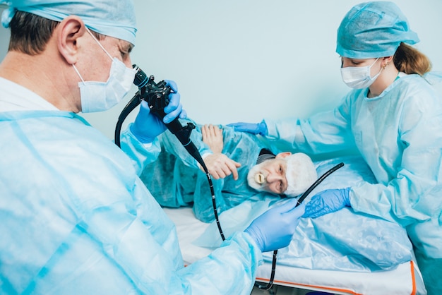 Endoscopy at the hospital. Doctor holding endoscope before gastroscopy