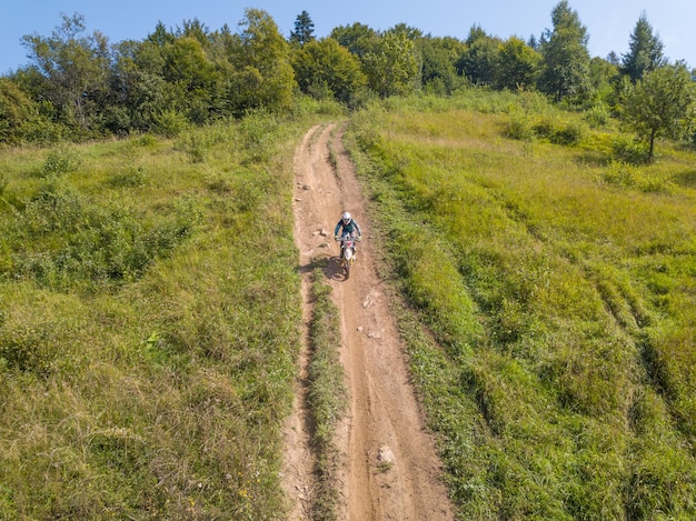 Enduro Athlete on a Summer Forest Road Aerial View