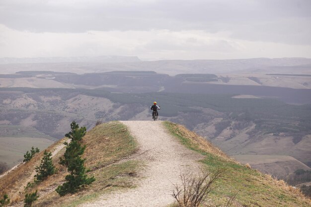 Enduro bike stands on a cliff