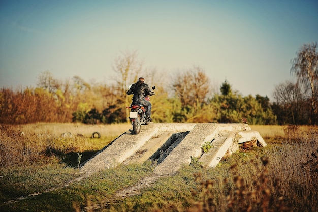 Enduro racer sitting on his motorcycle