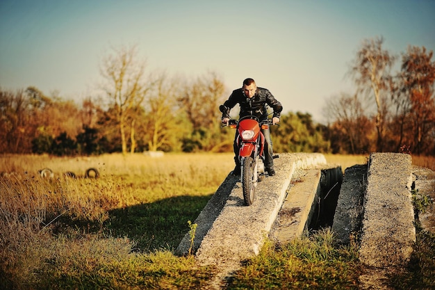 Enduro racer sitting on his motorcycle