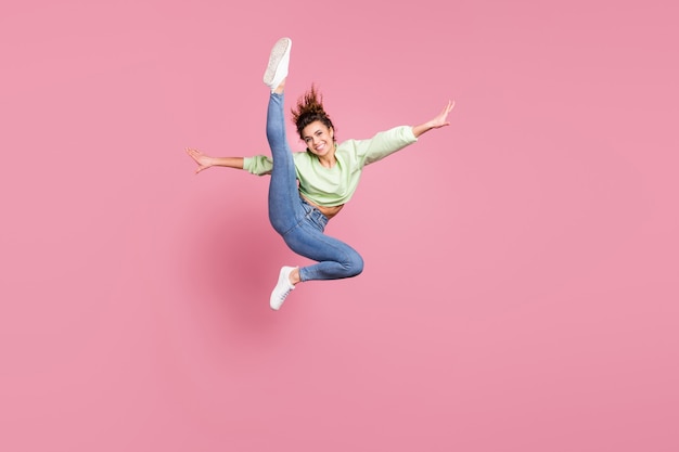 energetic cheerful girl jumping making exercise