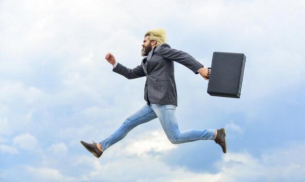 Energetic entrepreneur. Business man formal suit carries briefcase. Illegal deal business. Feel impact. Hipster hold briefcase. Businessman run away business case. Happy worker. Freedom. Feeling free.