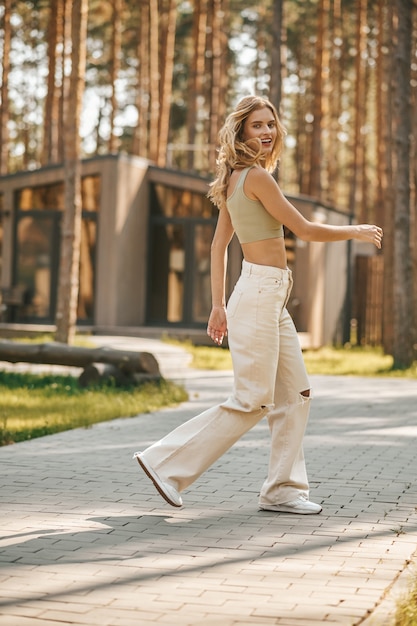 Energetic young woman walking in park