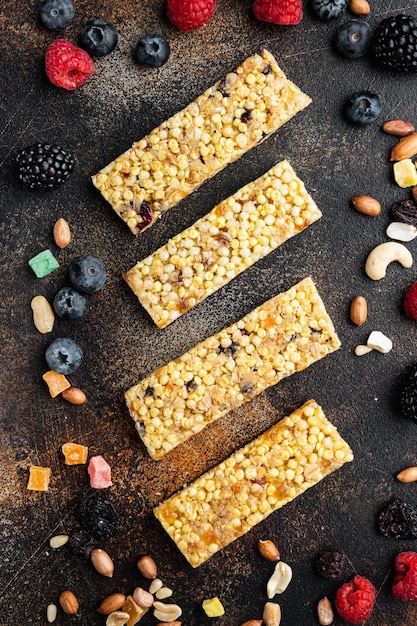 Energy bars snack, flat lay, on old dark table