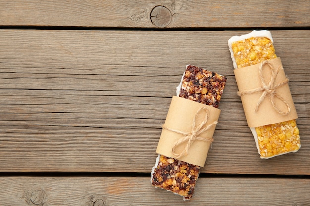 Photo energy bars - snack for healthy still life with copy space on grey background.