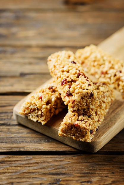 Energy bars with dryed fruits on the wooden table