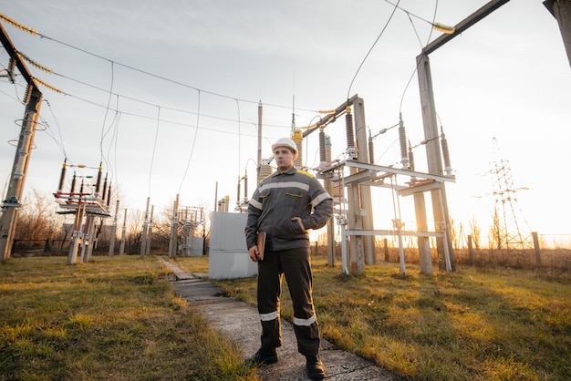 The energy engineer inspects the equipment of the substation. Power engineering. Industry