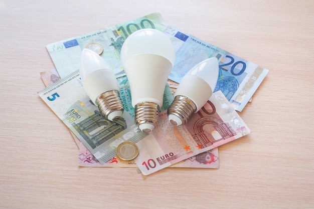 Energy-saving lamps and Arab dirhams. The concept of saving.