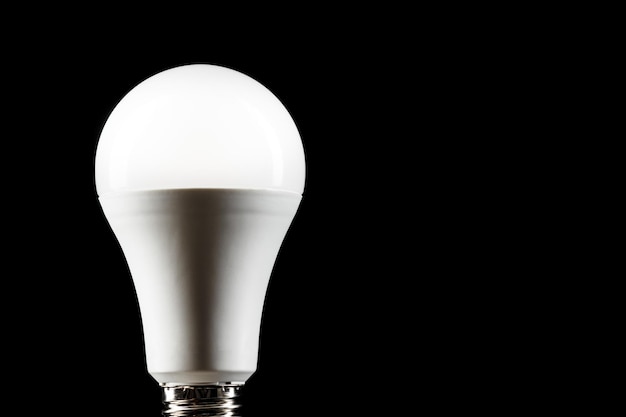 Energy saving light bulb on black background LED light bulb