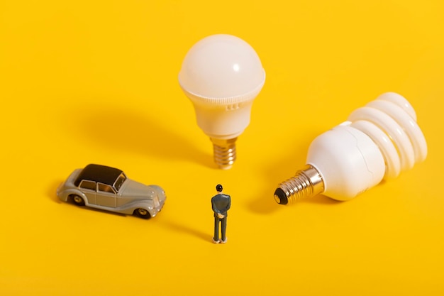 Energy Saving Light Bulb Car Miniature Creative Background Poster