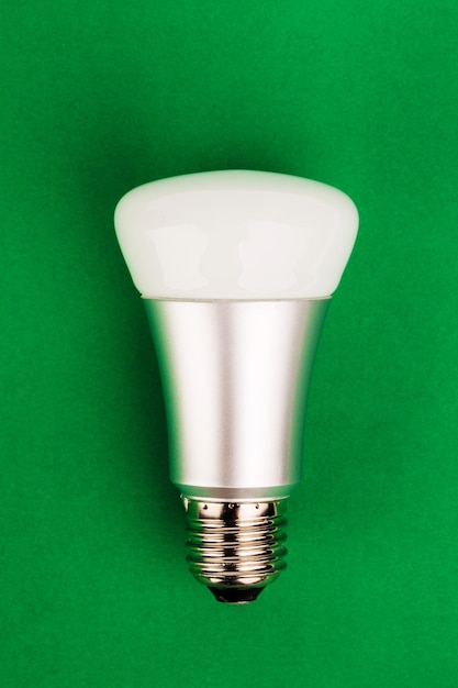 Energy saving wifi light bulb on green background