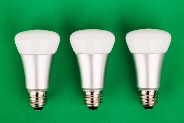 Energy saving wifi light bulb on green background