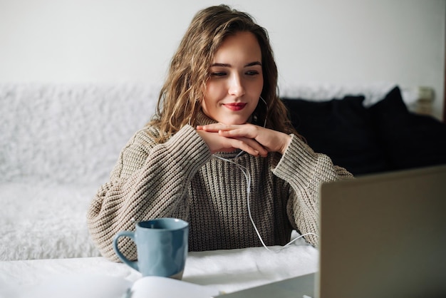 Engaged female freelancer in video conference with employer attentively discussing project details