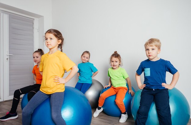 Engaged kids while physical education lessons at preschool