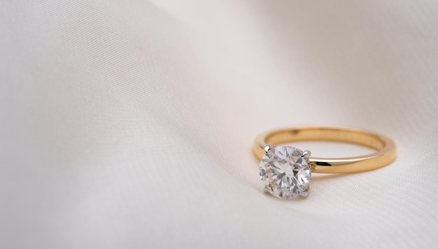 Engagement Diamond Ring on Soft White Fabric Background